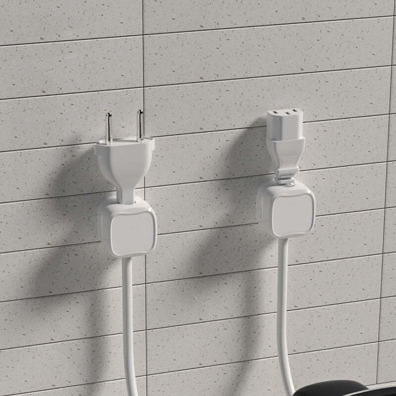 Black cable clips holding multiple chargers in organized layout