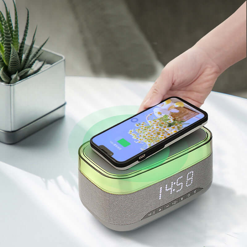 4-in-1 smart clock with wireless charging, LED display, and phone on top, emphasizing its multifunctionality and modern design.