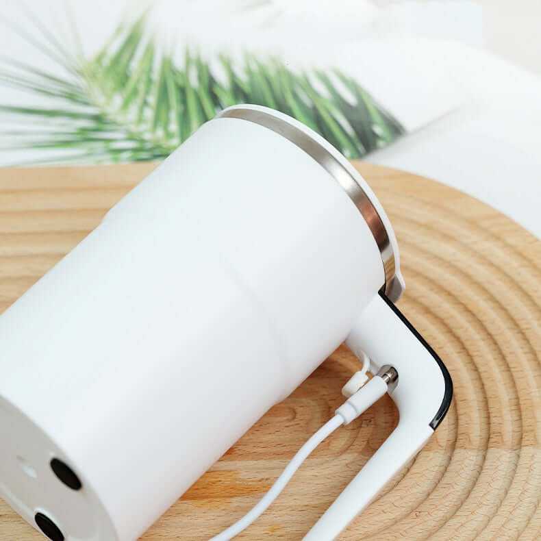 Pouring coffee into USB self-stirring mug – perfect for home or office use