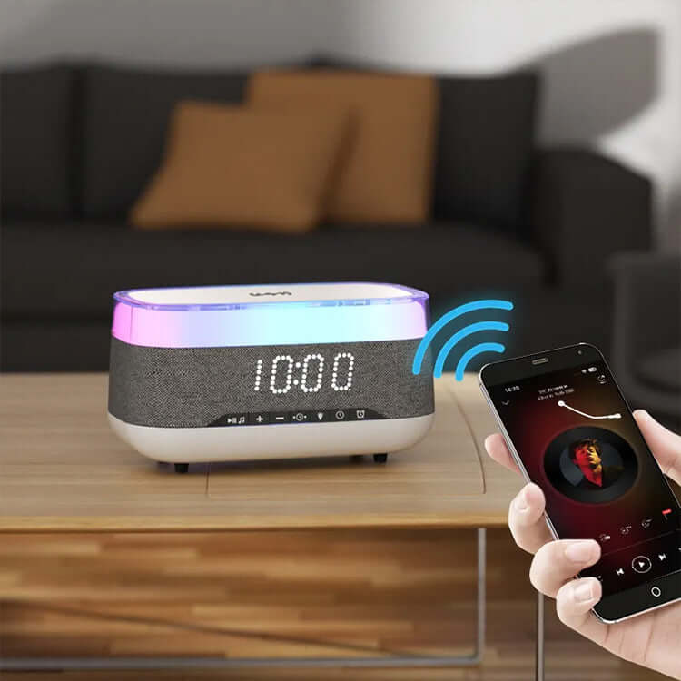 4-in-1 Smart Alarm Clock with Bluetooth speaker, LED display, and wireless charging on a bedside table.
