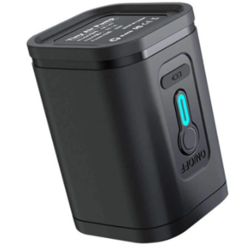 Compact black USB battery pack with on/off button for easy charging on the go.