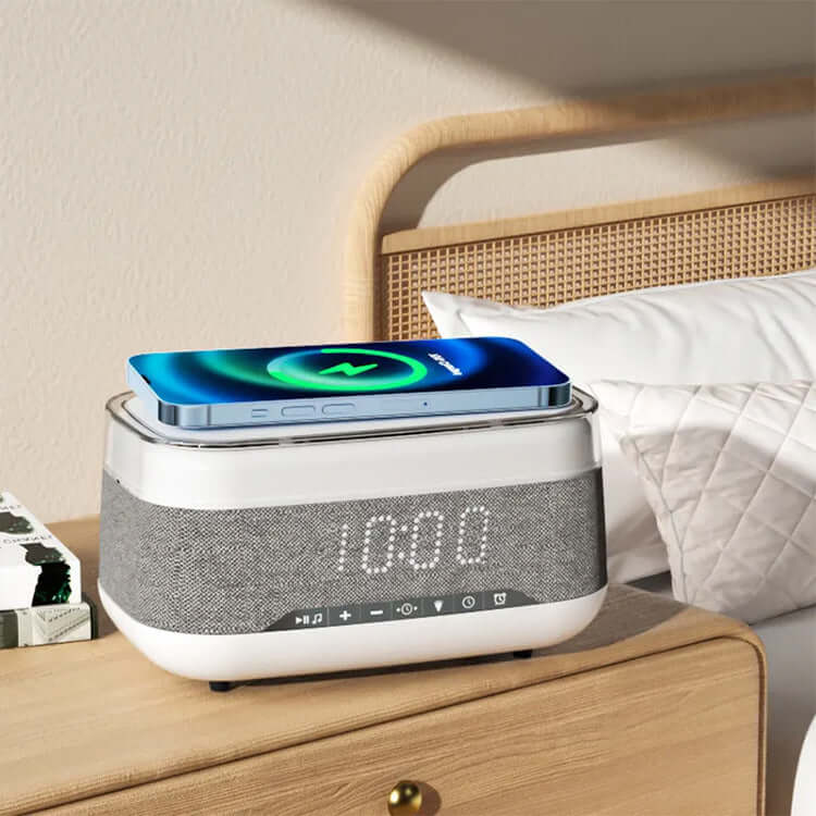 4-in-1 smart clock with wireless phone charger and LED display on bedside table.