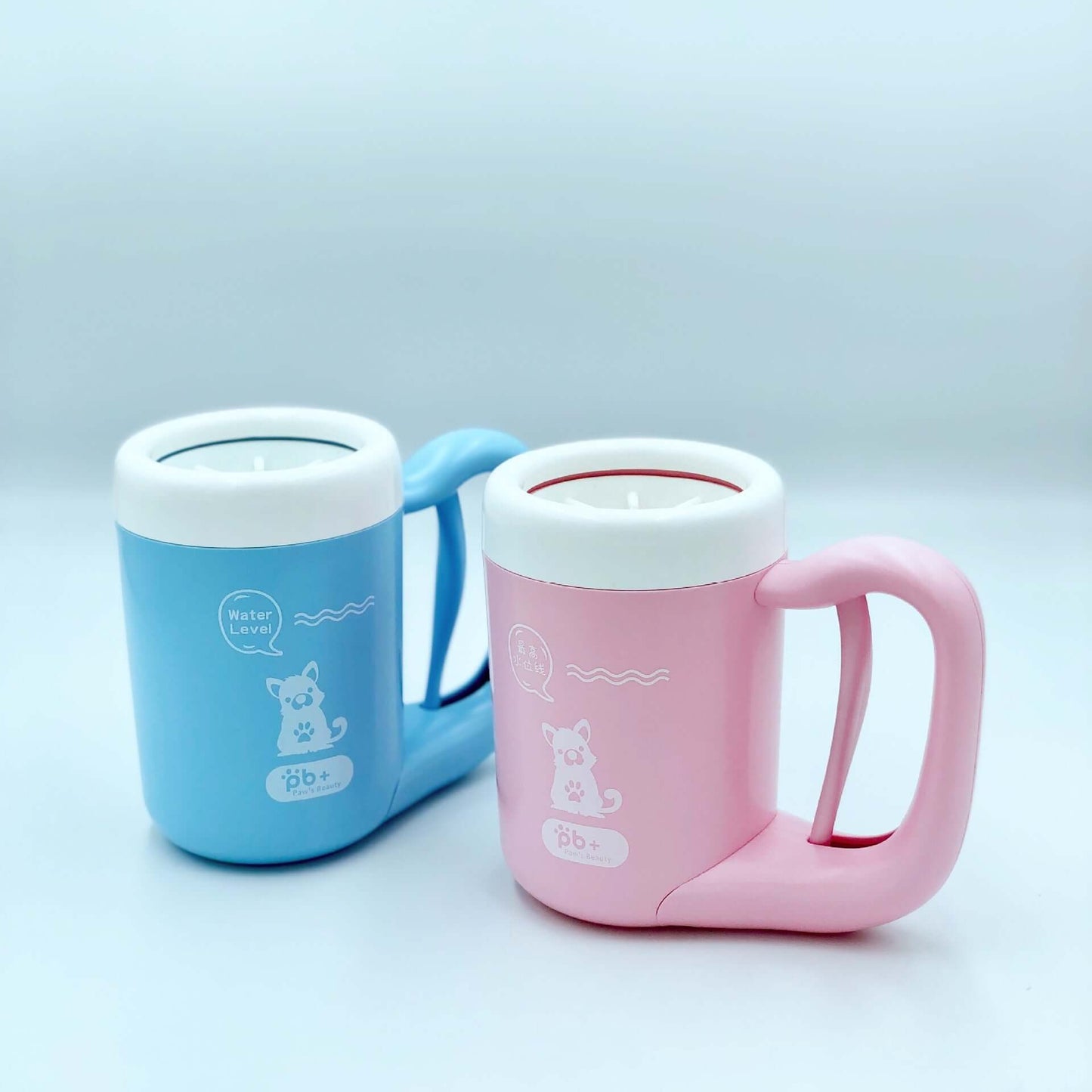 Two Pet Paw Cleaner Cup, one blue and one pink, on a light gray background